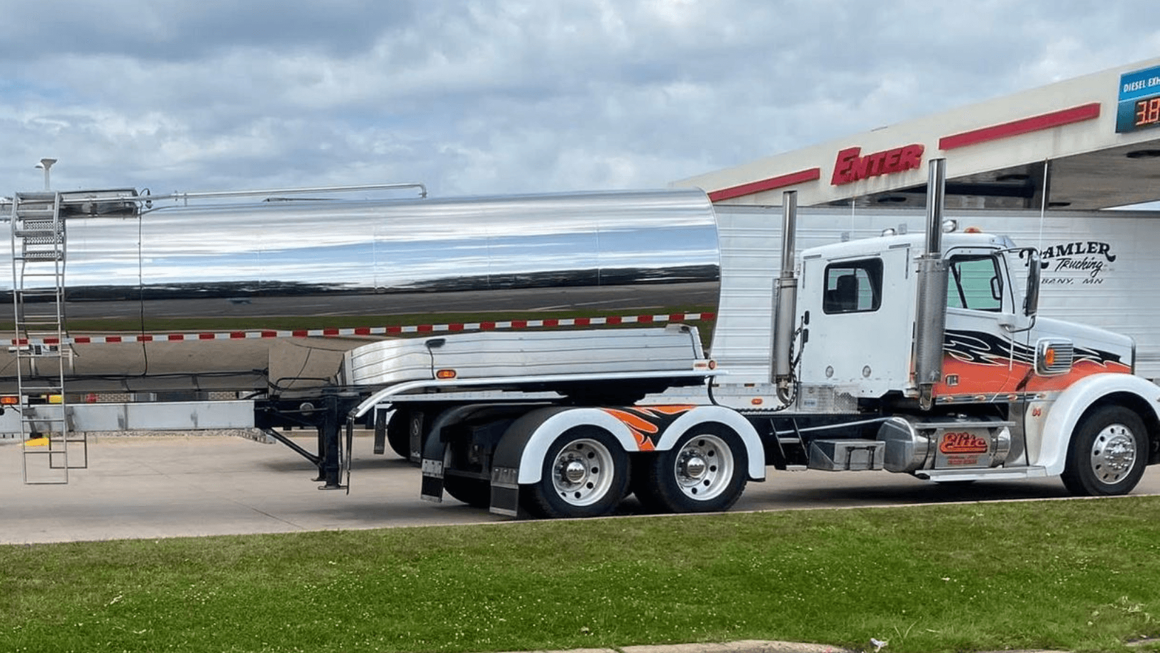 Elite Transport Group milk tanker truck and driver at a truck stop
