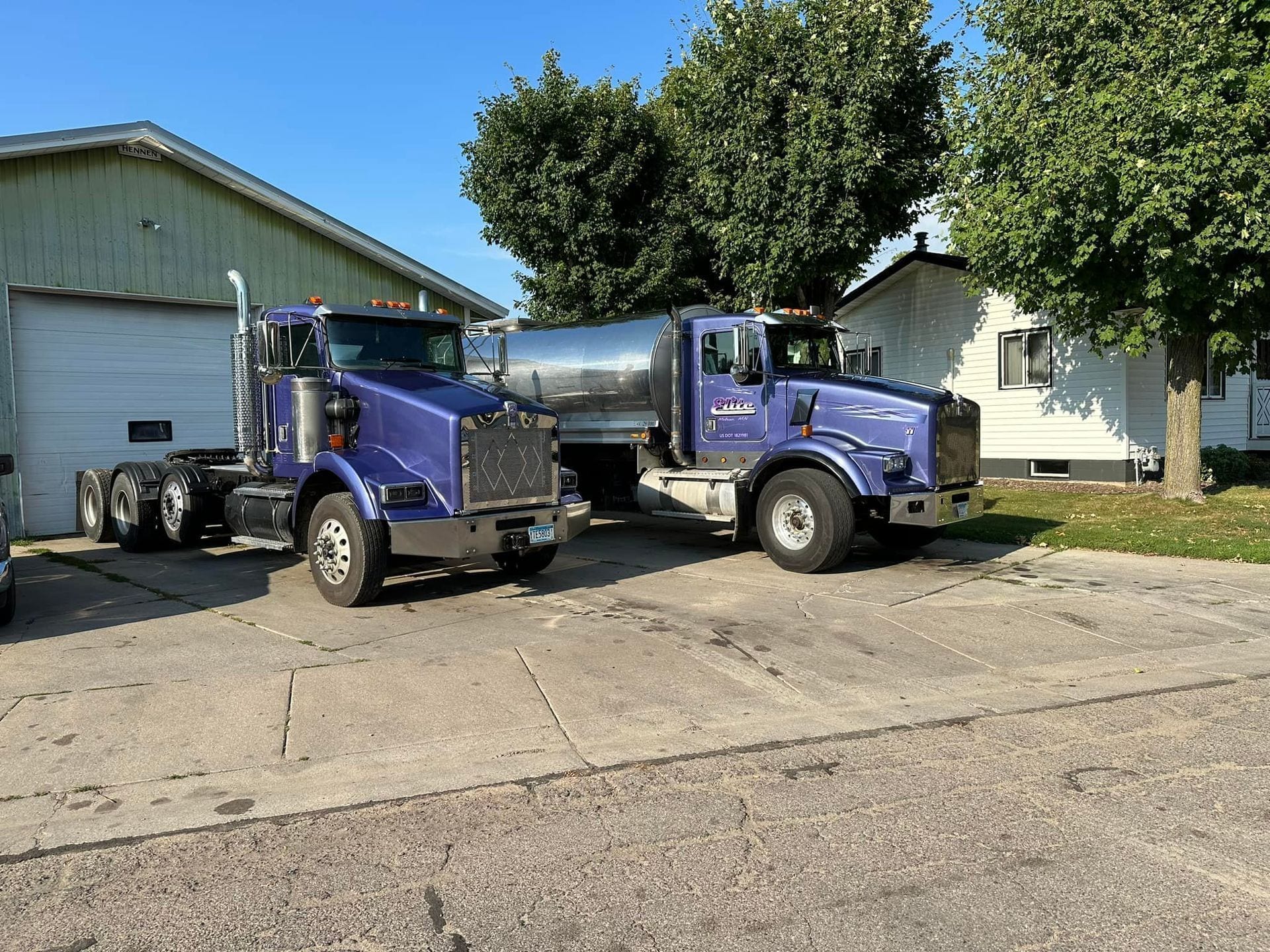 Two Elite Transport Group milk tanker trucks parked in Melrose, MN